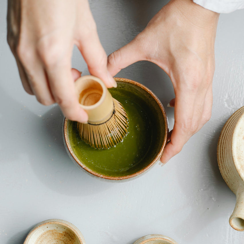 Whisked matcha green tea in a ceramic bowl